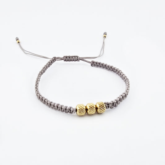 Pulsera Nudos Nude Cuentas Rayadas Doradas